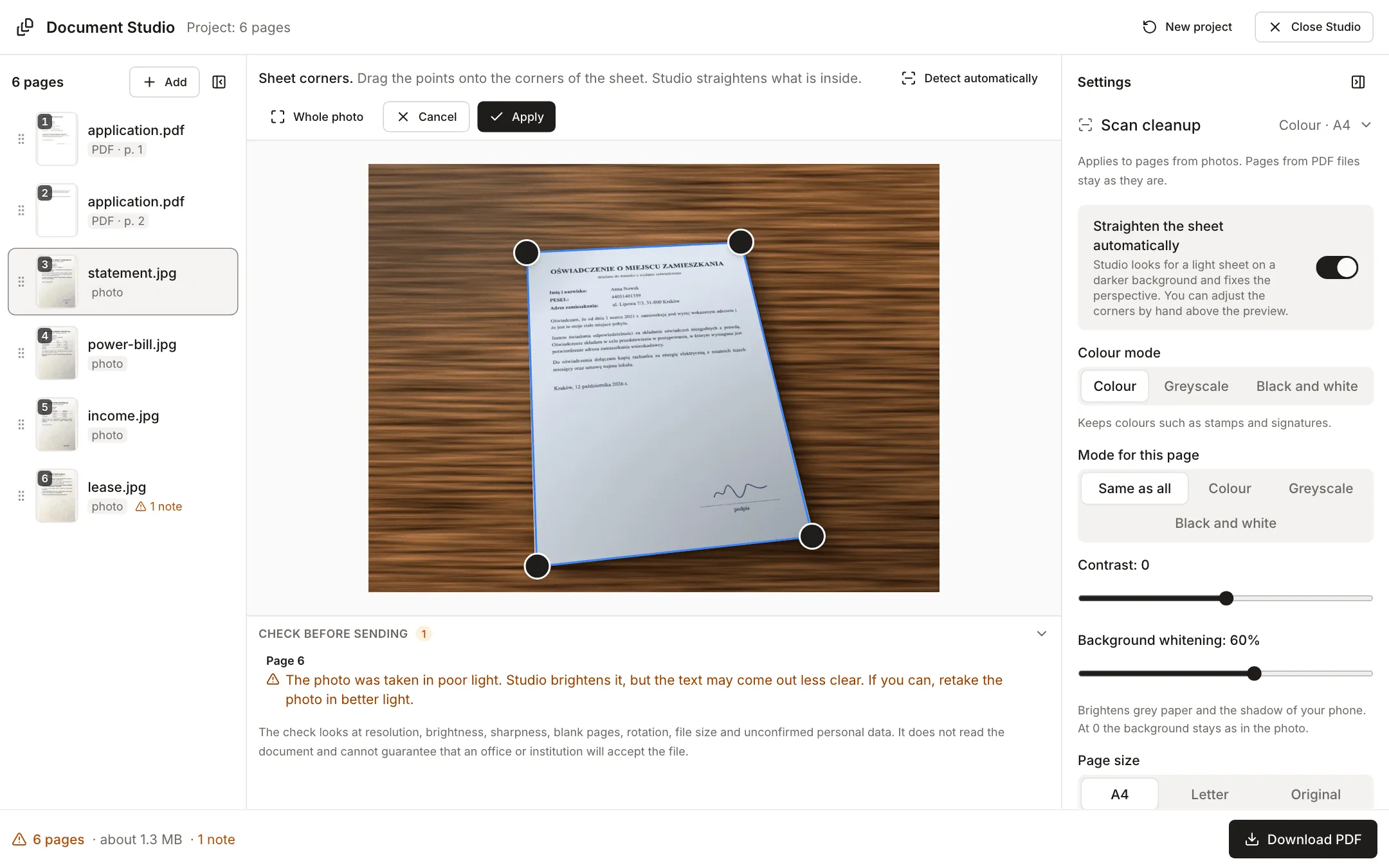 Corner editor: the photo of a statement on a wooden table with four points on the corners of the sheet, and the buttons Whole photo, Cancel and Apply